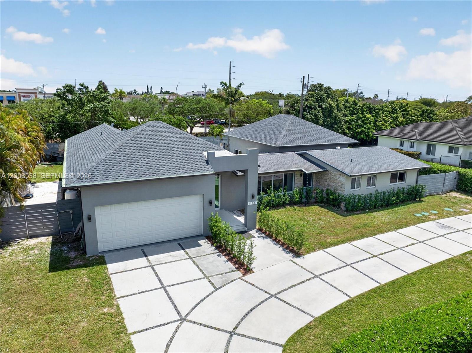 11811 Southwest 82nd Road Miami, FL 33156 - Photo 63 of 63 a aerial view of a house with a yard and potted plants