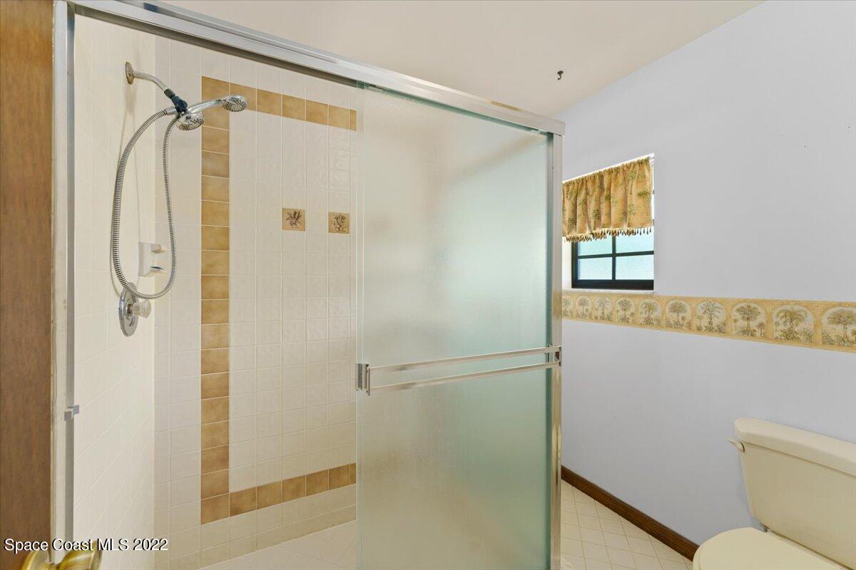 224 Rheine Road Northwest Palm Bay, FL 32907 - Photo 18 of 32 a bathroom with a shower and a shower