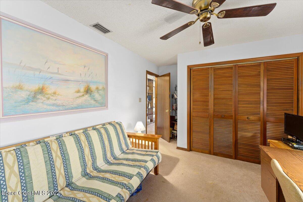 224 Rheine Road Northwest Palm Bay, FL 32907 - Photo 20 of 32 a bedroom with furniture and a window