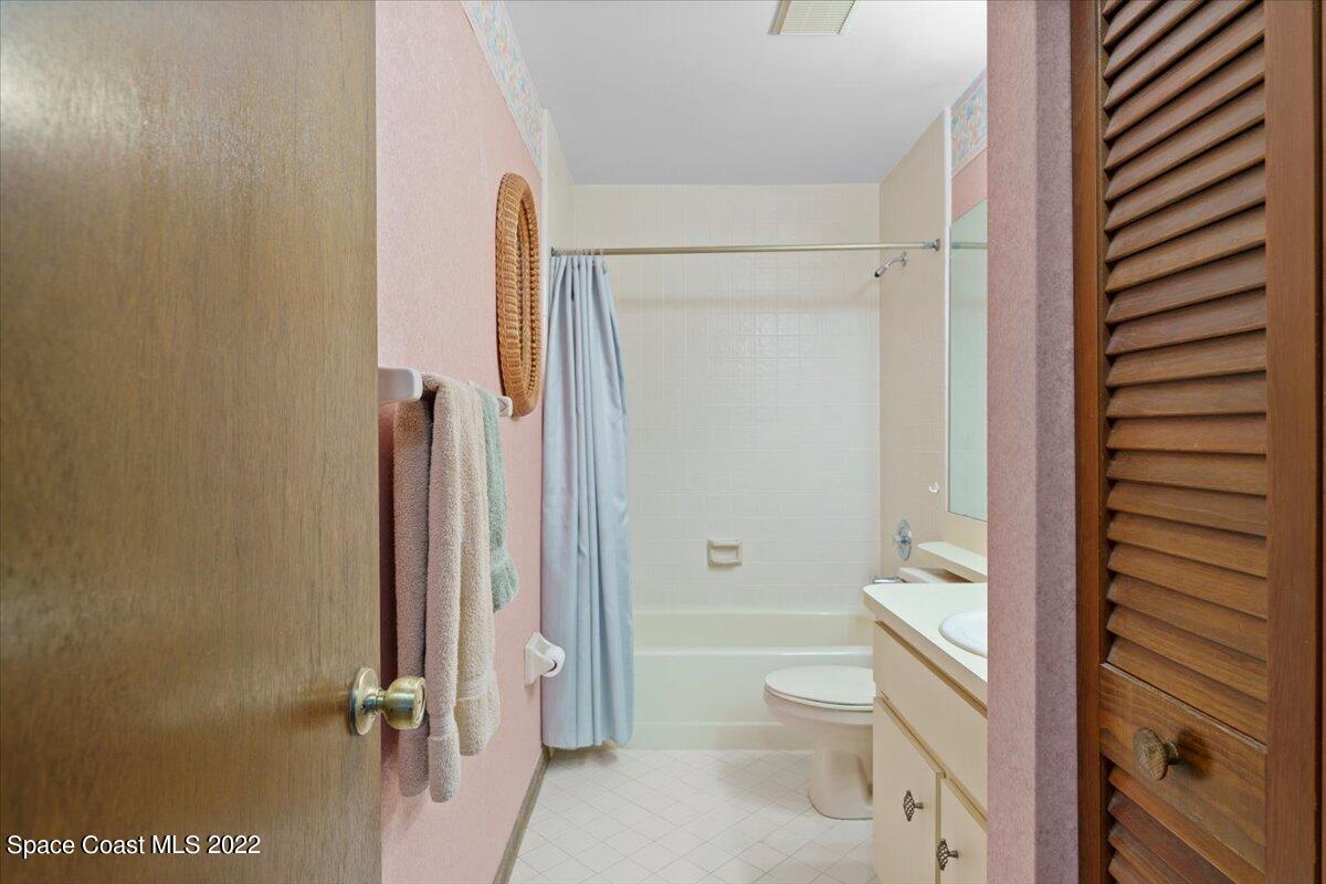 224 Rheine Road Northwest Palm Bay, FL 32907 - Photo 23 of 32 a bathroom with a toilet a sink and shower