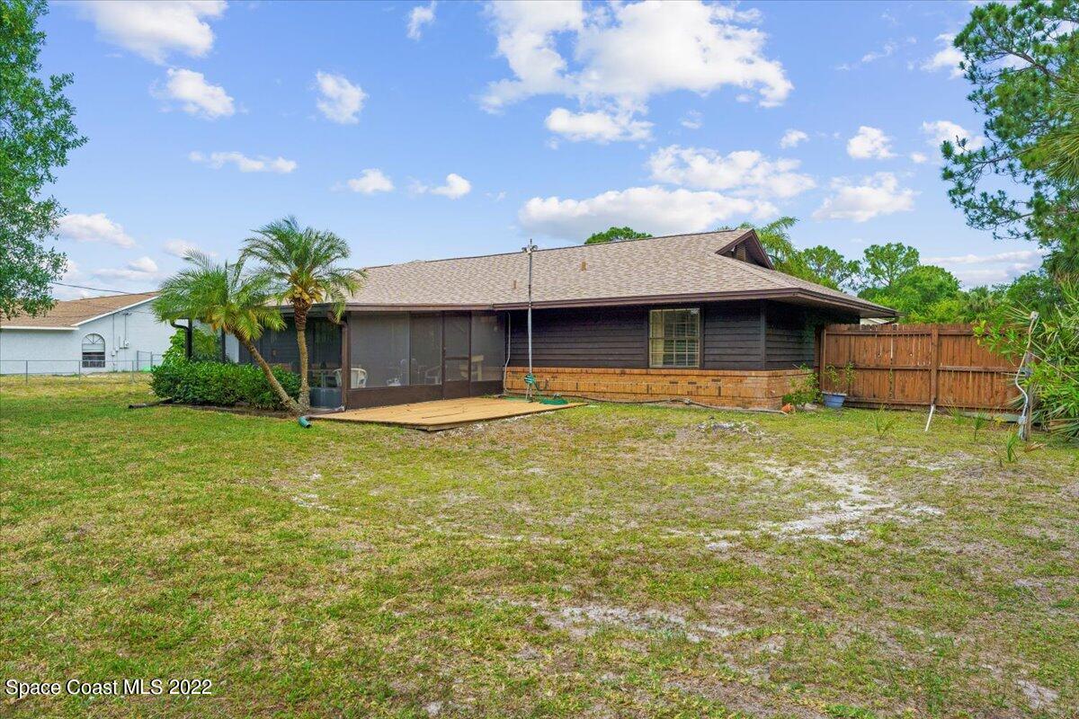 224 Rheine Road Northwest Palm Bay, FL 32907 - Photo 29 of 32 a front view of a house with a yard