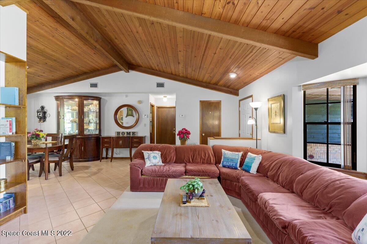 224 Rheine Road Northwest Palm Bay, FL 32907 - Photo 6 of 32 a living room with furniture and a large window