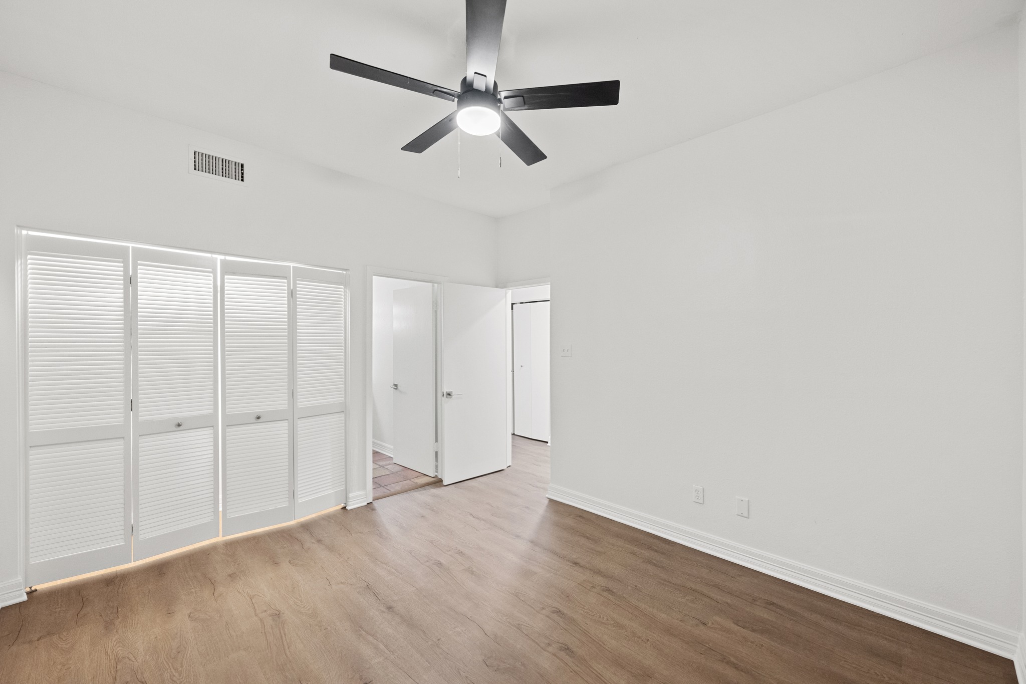 409 East 38th Street, Unit 101 Austin, TX 78705 - Photo 18 of 27 Second bedroom looking towards closet and entry to bathroom.