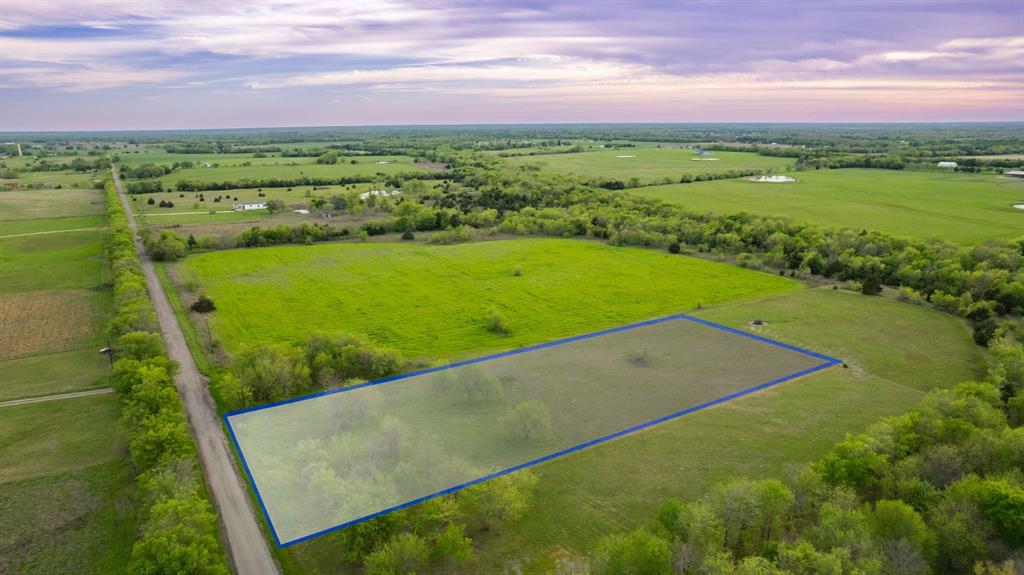 4804 County Road 4506 Commerce, TX 75428 - Photo 11 of 11 a view of a field with an ocean