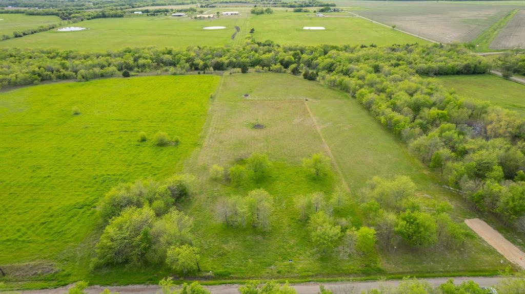 4804 County Road 4506 Commerce, TX 75428 - Photo 7 of 11 a view of yard with swimming pool