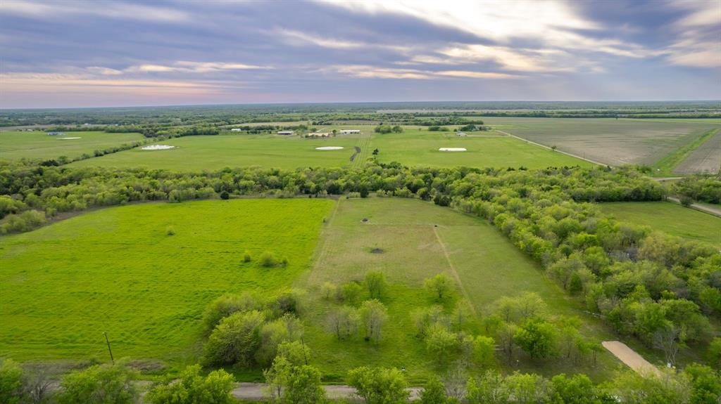 4804 County Road 4506 Commerce, TX 75428 - Photo 9 of 11 a view of a lake with a big yard