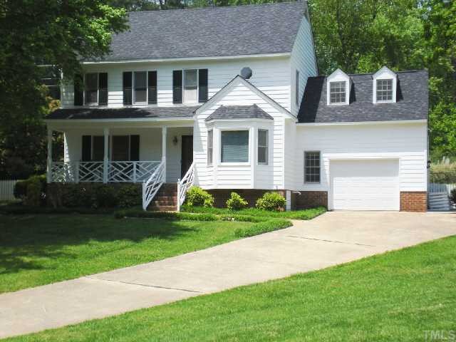 5313 Thaxton Place Raleigh, NC 27612 - Photo 1 of 1 a front view of a house with a garden and yard