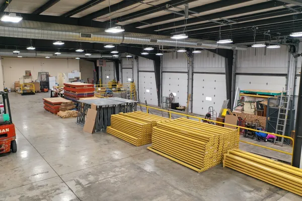 a living room with lots of furniture and a chandelier