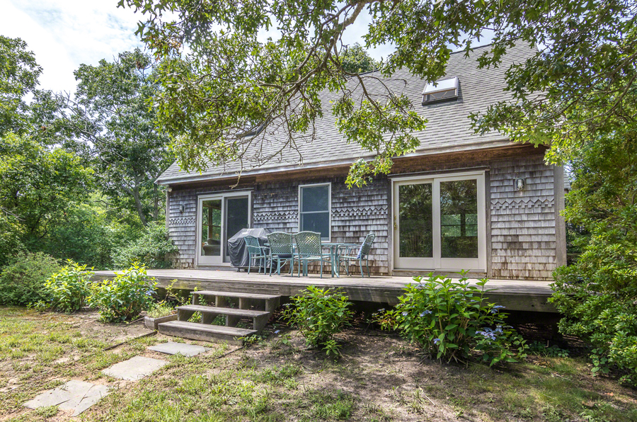 15 Meshacket Road Edgartown, MA 02539 - Photo 2 of 19 a house view with a sitting space and garden