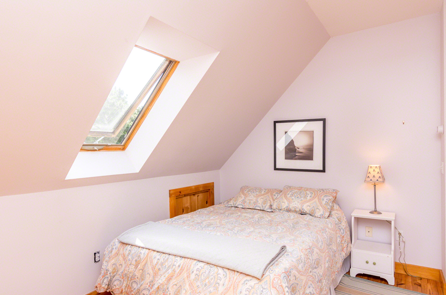 15 Meshacket Road Edgartown, MA 02539 - Photo 11 of 19 a bedroom with a bed and a window