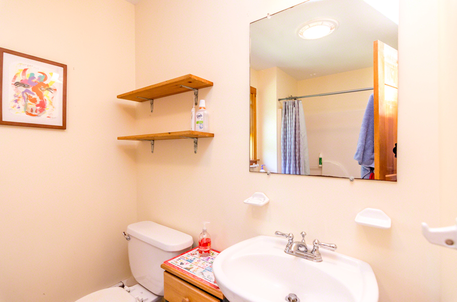 15 Meshacket Road Edgartown, MA 02539 - Photo 15 of 19 a bathroom with a sink mirror and toilet