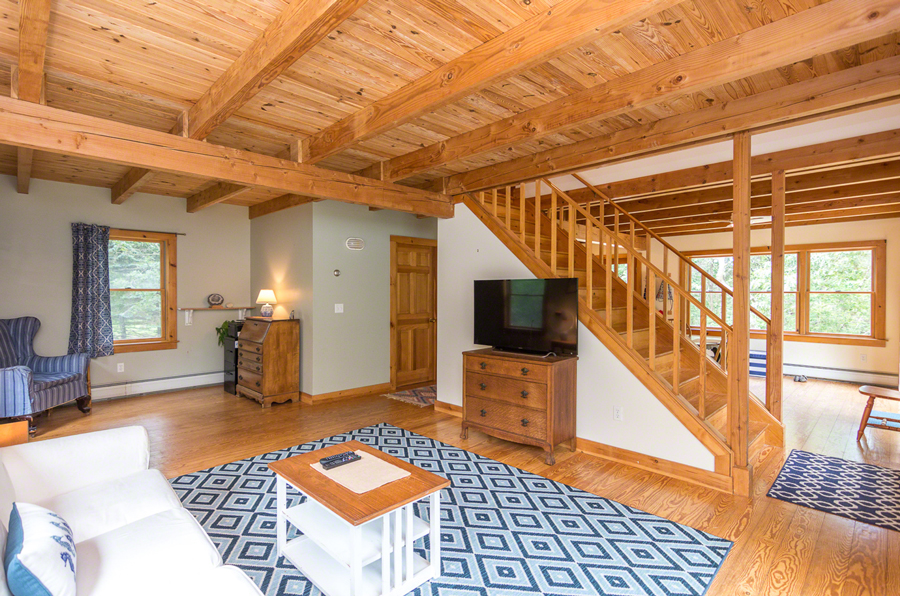 15 Meshacket Road Edgartown, MA 02539 - Photo 3 of 19 a living room with furniture and a flat screen tv