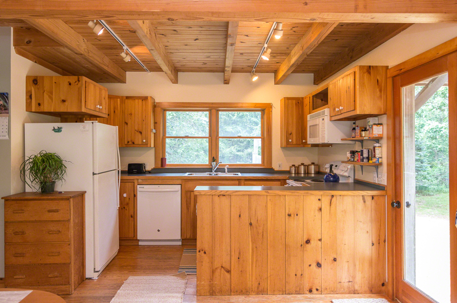15 Meshacket Road Edgartown, MA 02539 - Photo 7 of 19 a kitchen with stainless steel appliances granite countertop a refrigerator and a sink