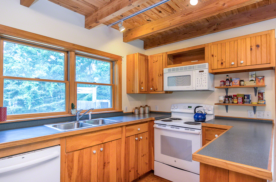 15 Meshacket Road Edgartown, MA 02539 - Photo 8 of 19 a kitchen with stainless steel appliances a sink window and cabinets