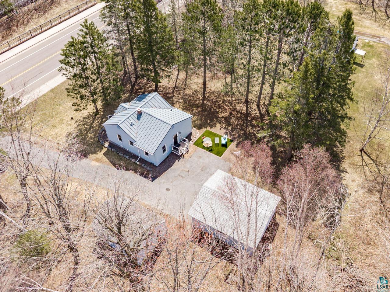 3645 Haines Road Hermantown, MN 55811 - Photo 8 of 35 Property featuring a light-colored exterior and a metal roof