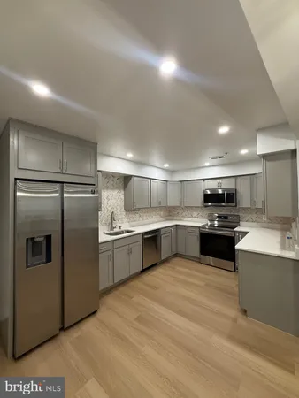 a view of an empty room with a chandelier