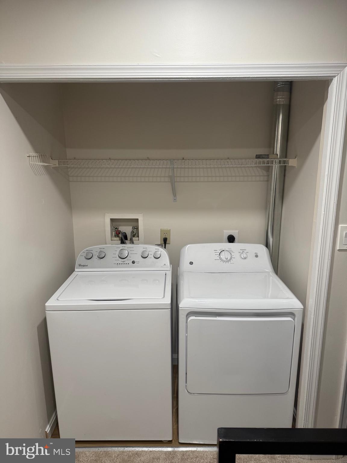 11281 Raging Brook Drive, Unit 307 Bowie, MD 20720 - Photo 6 of 11 a utility room with dryer and washer