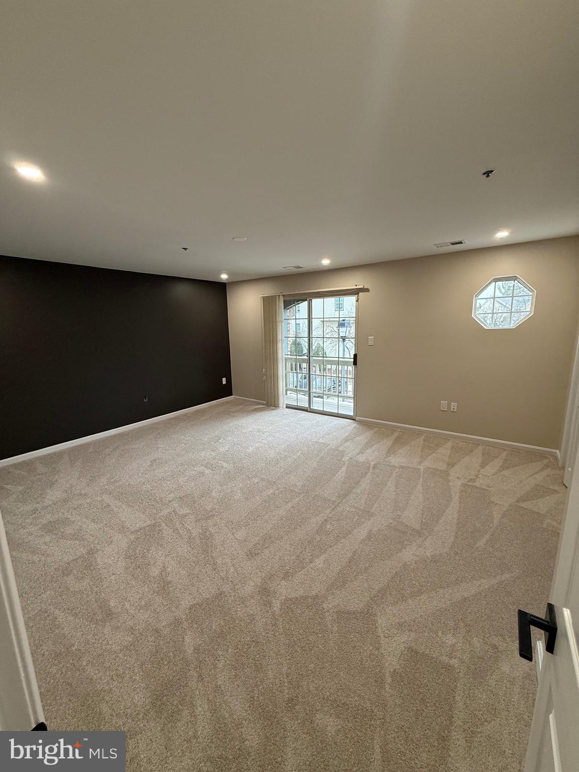 11281 Raging Brook Drive, Unit 307 Bowie, MD 20720 - Photo 7 of 11 a view of an empty room with a window