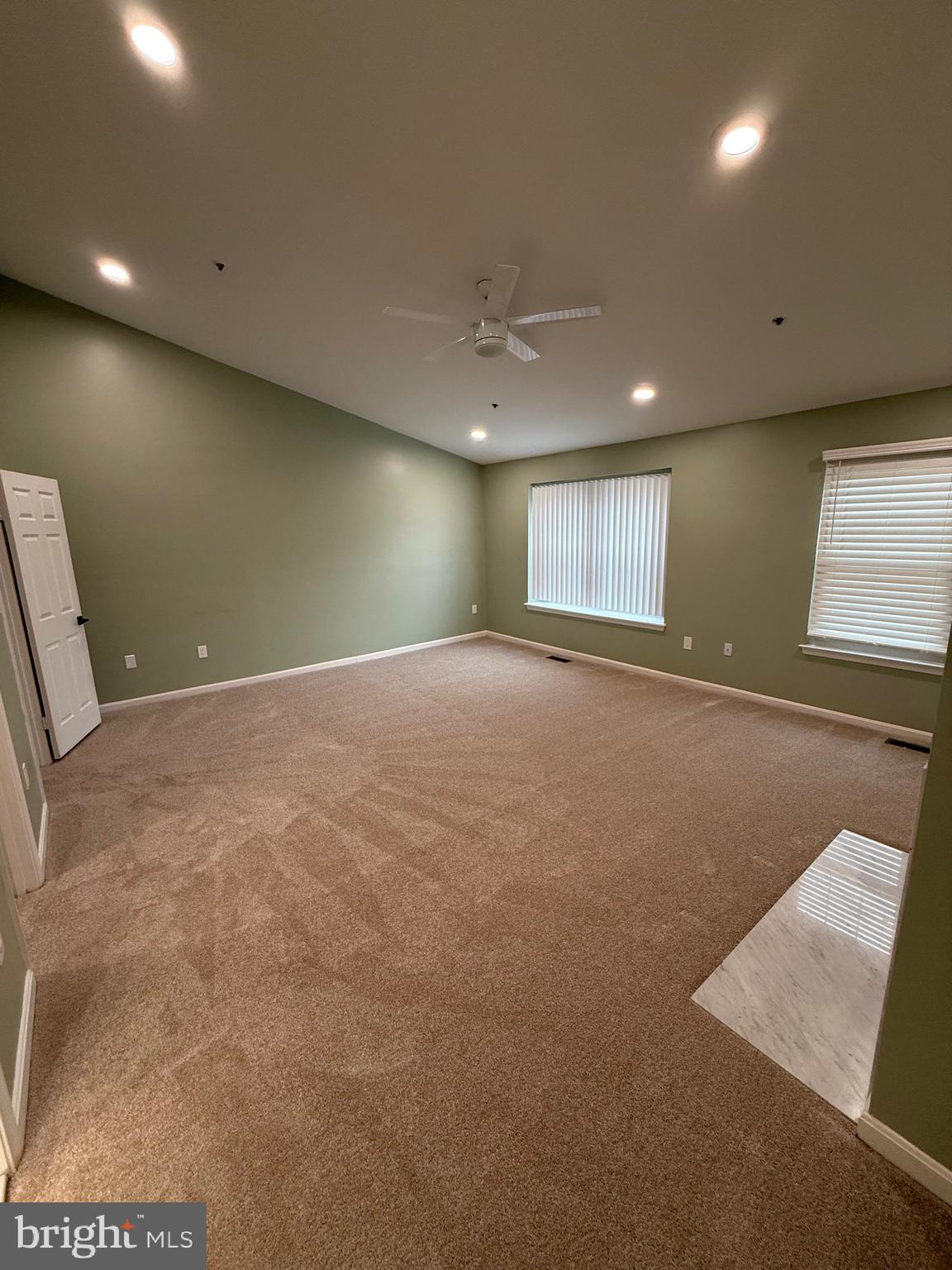 11281 Raging Brook Drive, Unit 307 Bowie, MD 20720 - Photo 10 of 11 a view of an empty room with a window