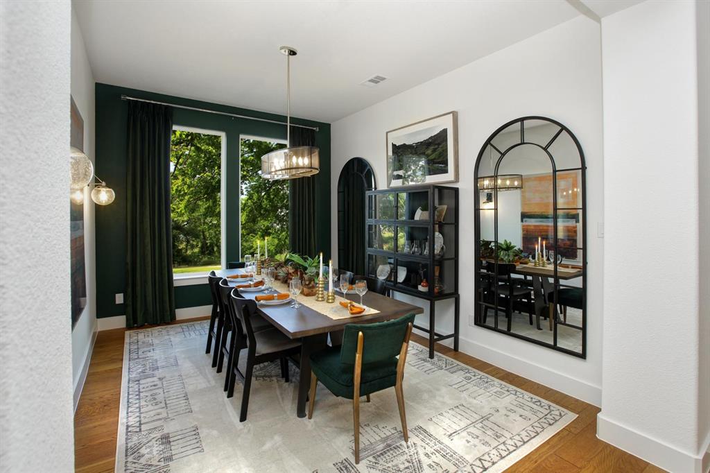 240 South Bee Balm Road McKinney, TX 75071 - Photo 12 of 23 a view of a dining room with furniture window and wooden floor