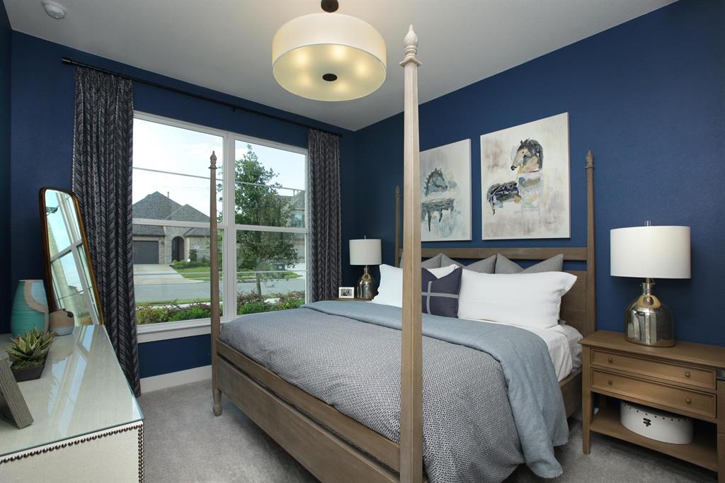 240 South Bee Balm Road McKinney, TX 75071 - Photo 18 of 23 a bedroom with a large bed and a large window