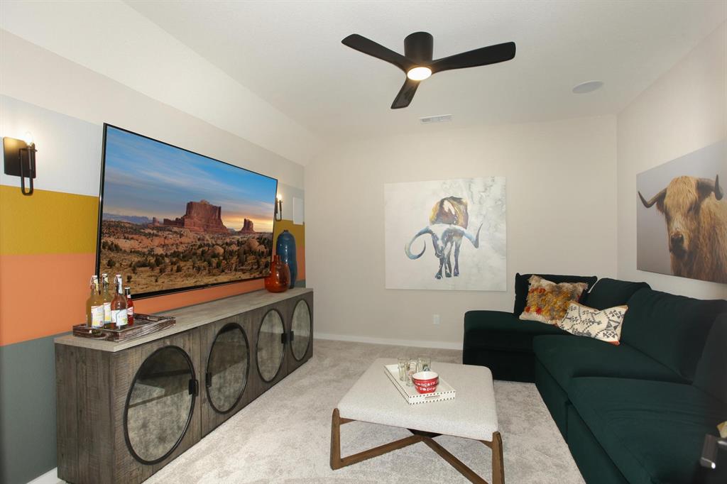 240 South Bee Balm Road McKinney, TX 75071 - Photo 20 of 23 a living room with furniture and a flat screen tv