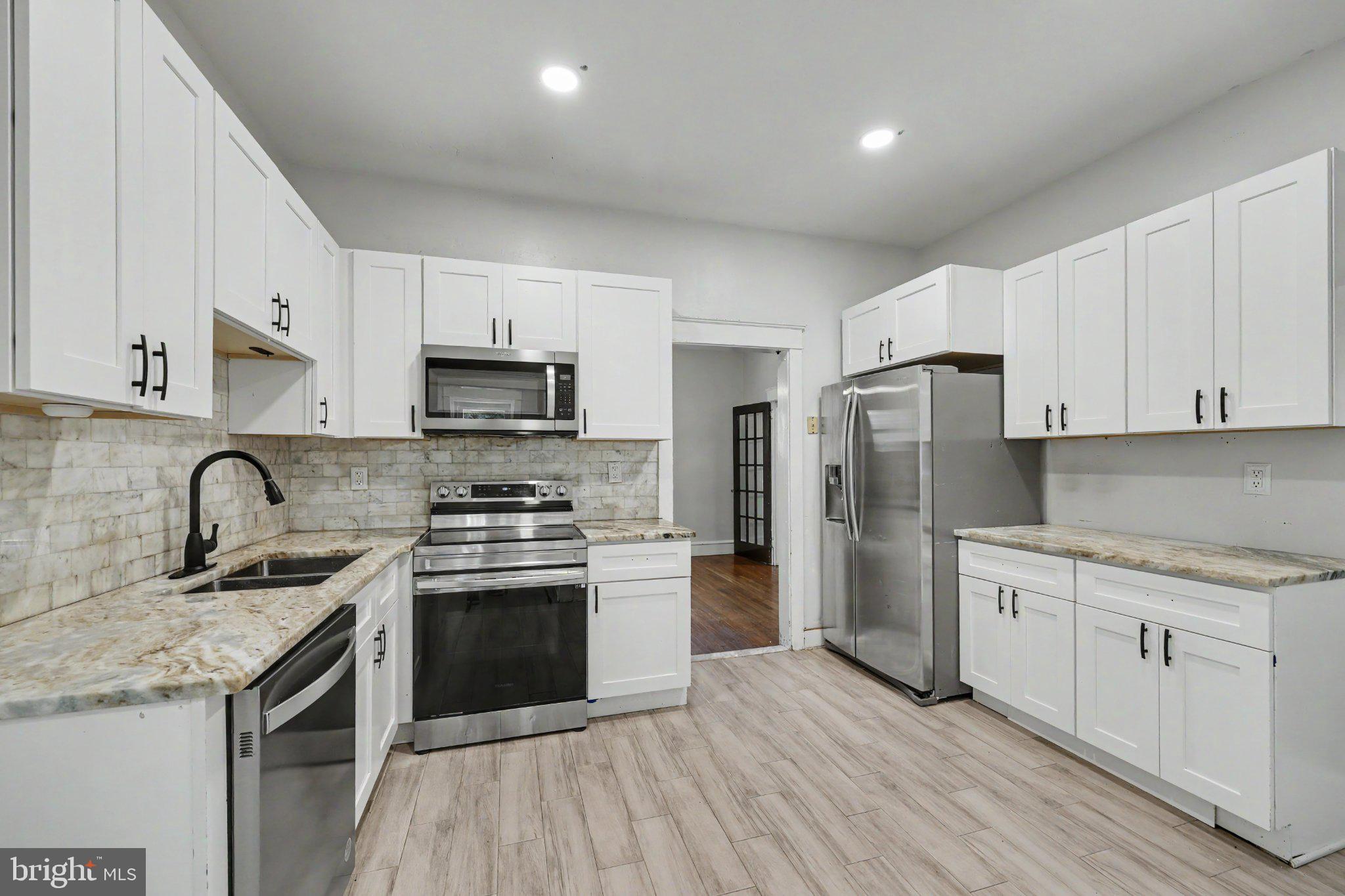 2470 Dutton Mill Road Aston, PA 19014 - Photo 14 of 52 KITCHEN WITH DINING ROOM ACCESS