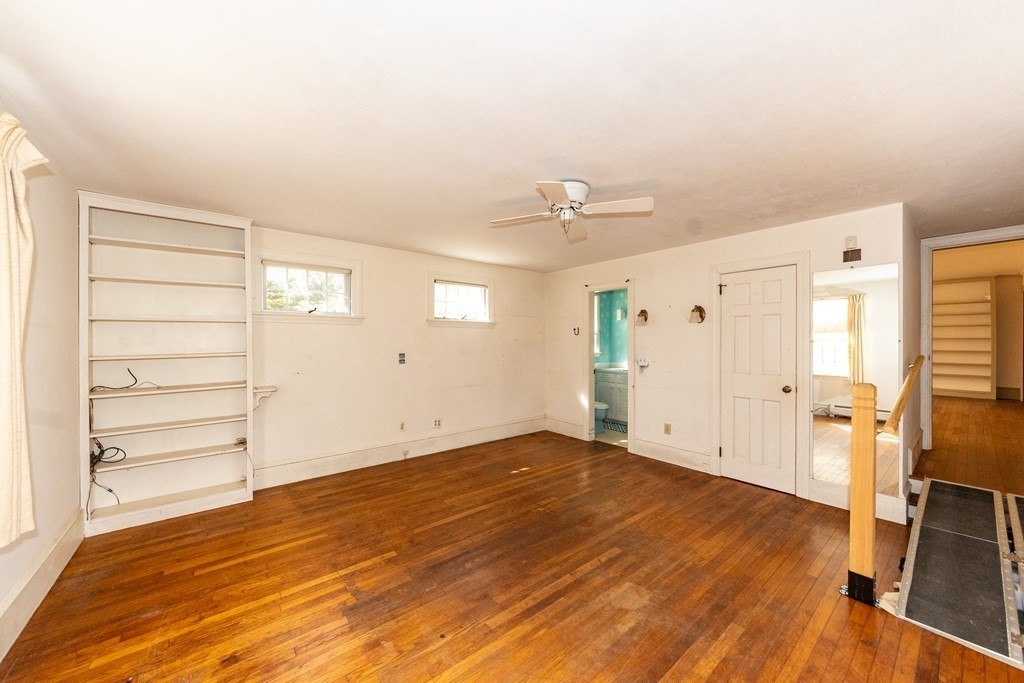 1489 Main Road Westport, MA 02790 - Photo 12 of 24 a view of empty room with wooden floor and fan