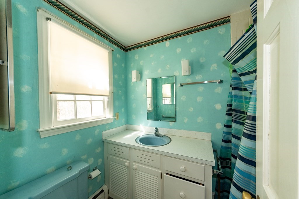 1489 Main Road Westport, MA 02790 - Photo 15 of 24 a bathroom with a sink a toilet and shower