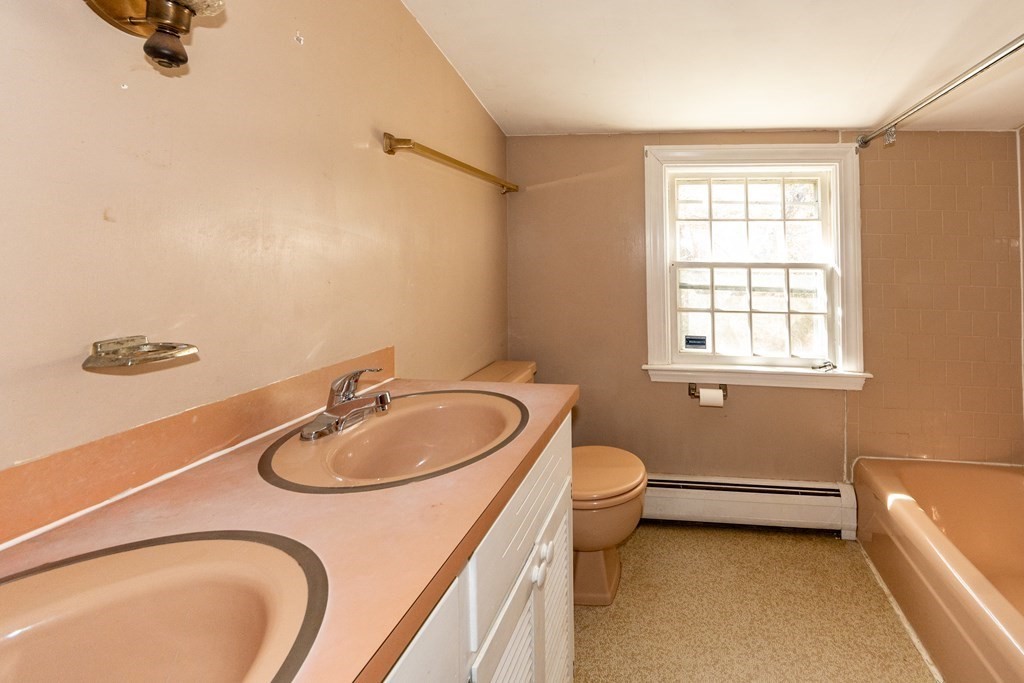 1489 Main Road Westport, MA 02790 - Photo 18 of 24 a bathroom with a sink a toilet and tub