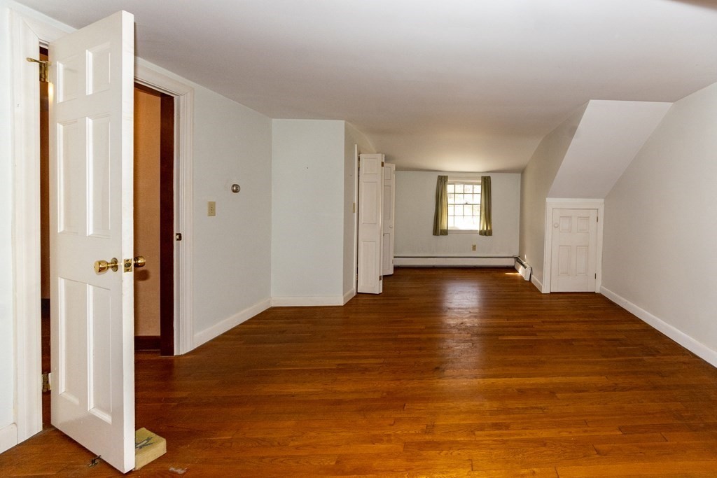 1489 Main Road Westport, MA 02790 - Photo 20 of 24 a view of empty room with wooden floor and window
