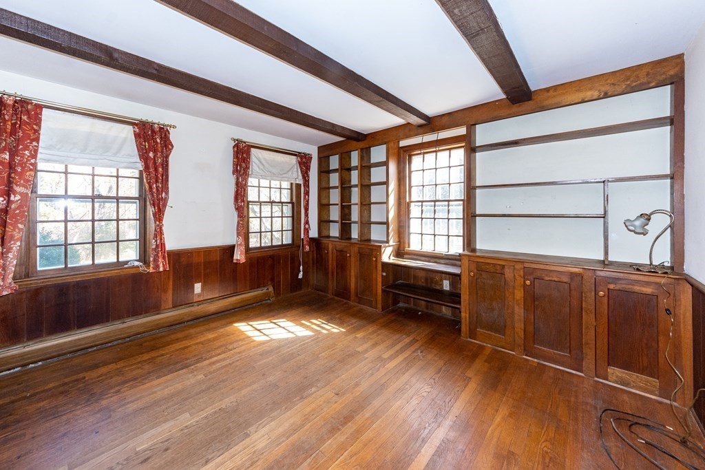 1489 Main Road Westport, MA 02790 - Photo 9 of 24 a view of an empty room with wooden floor and a window