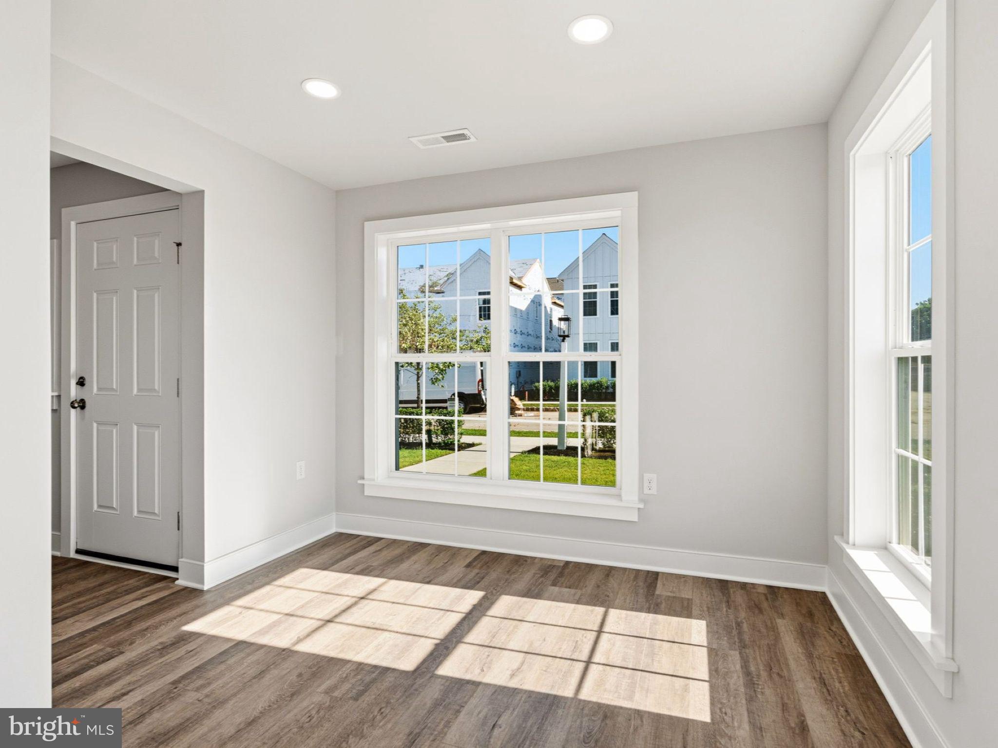 23 Snap Dragon Road Carlisle, PA 17015 - Photo 7 of 36 wooden floor in an empty room with a window