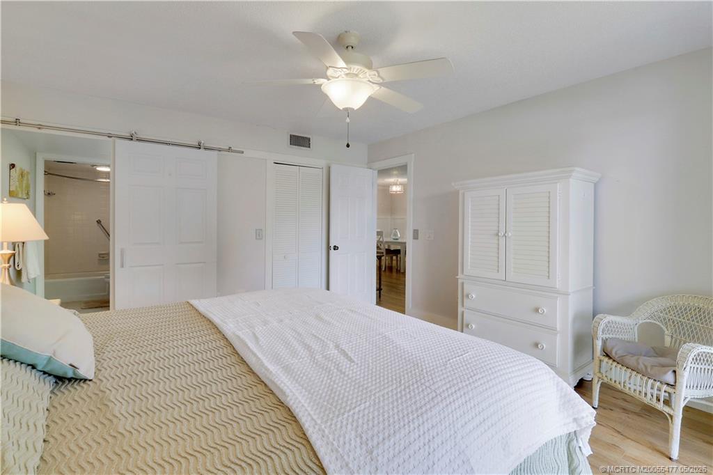 1852 Southwest Palm City Road, Unit 201 Stuart, FL 34994 - Photo 20 of 34 a large white bed in a white room