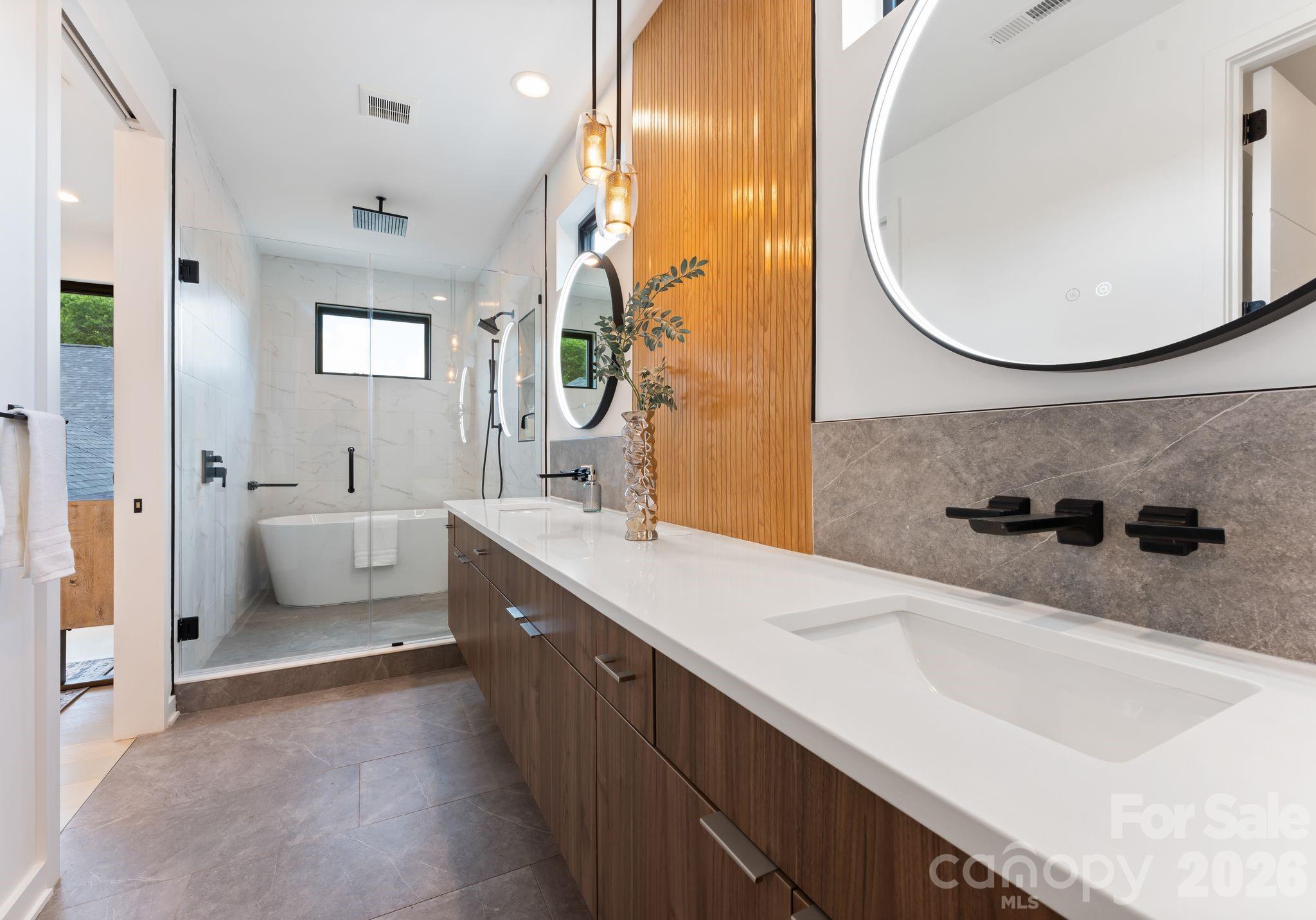 412 State Street Charlotte, NC 28208 - Photo 20 of 31 a spacious bathroom with a sink a mirror and a bathtub