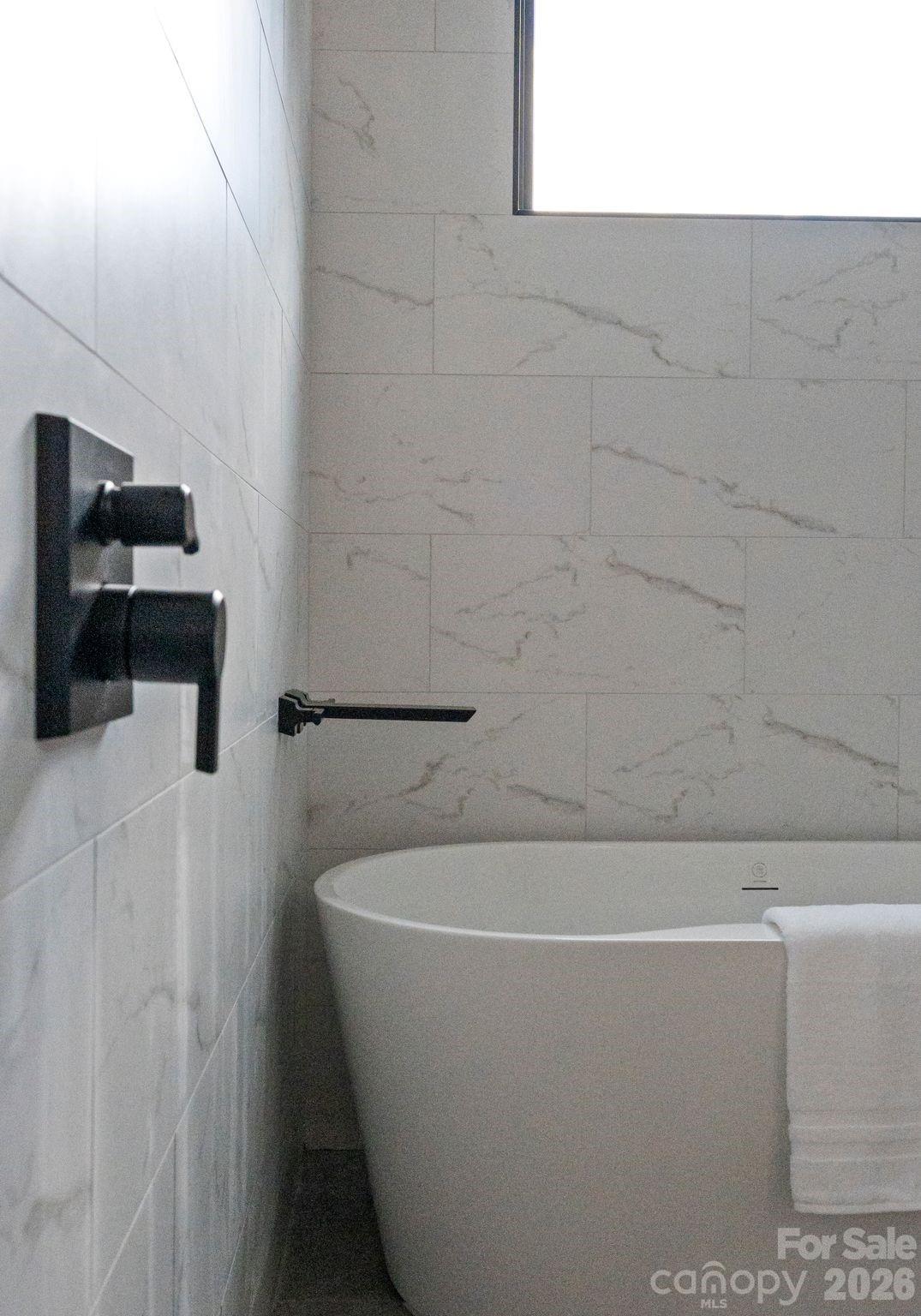 412 State Street Charlotte, NC 28208 - Photo 23 of 31 a white bath tub sitting in a bathroom