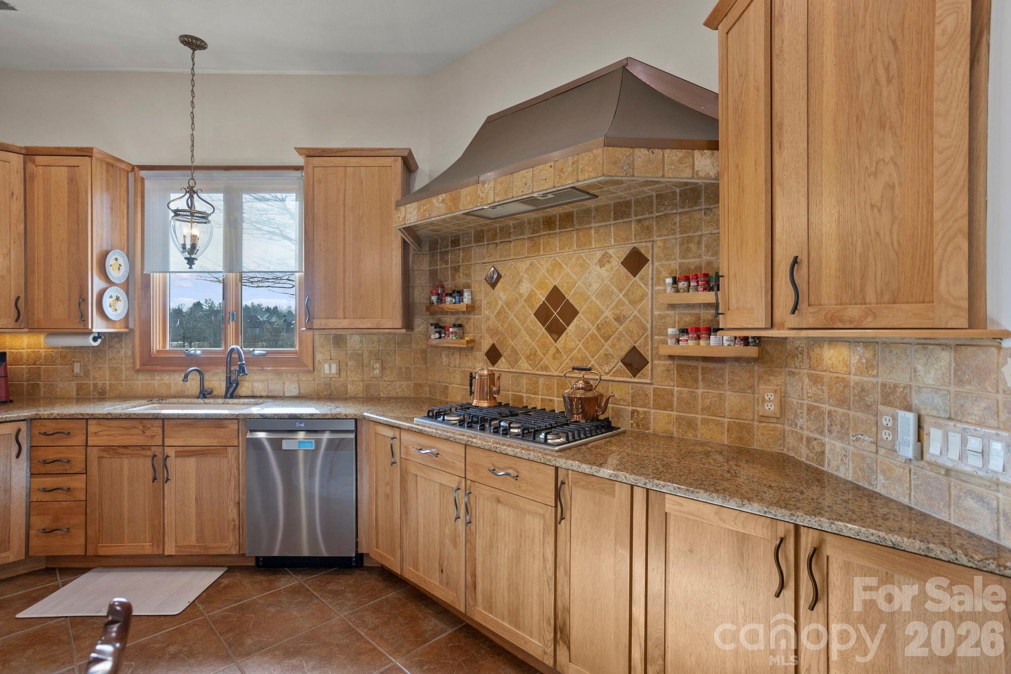628 Vista Falls Road Mills River, NC 28759 - Photo 15 of 37 a kitchen with stainless steel appliances a sink stove and cabinets