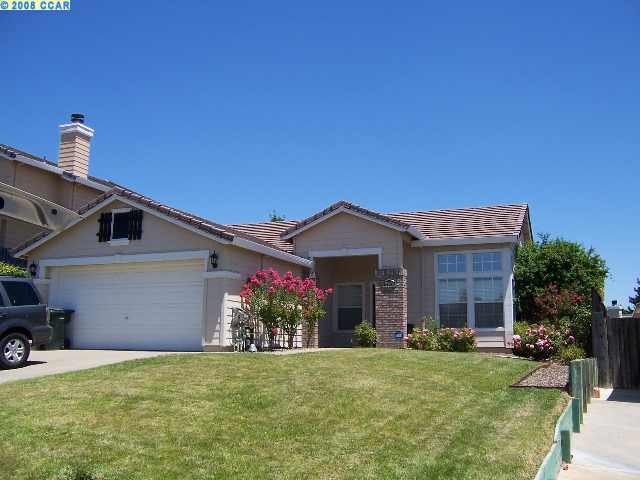 5157 Homestead Way Antioch, CA 94531 - Photo 1 of 1 a front view of a house with a yard and garage