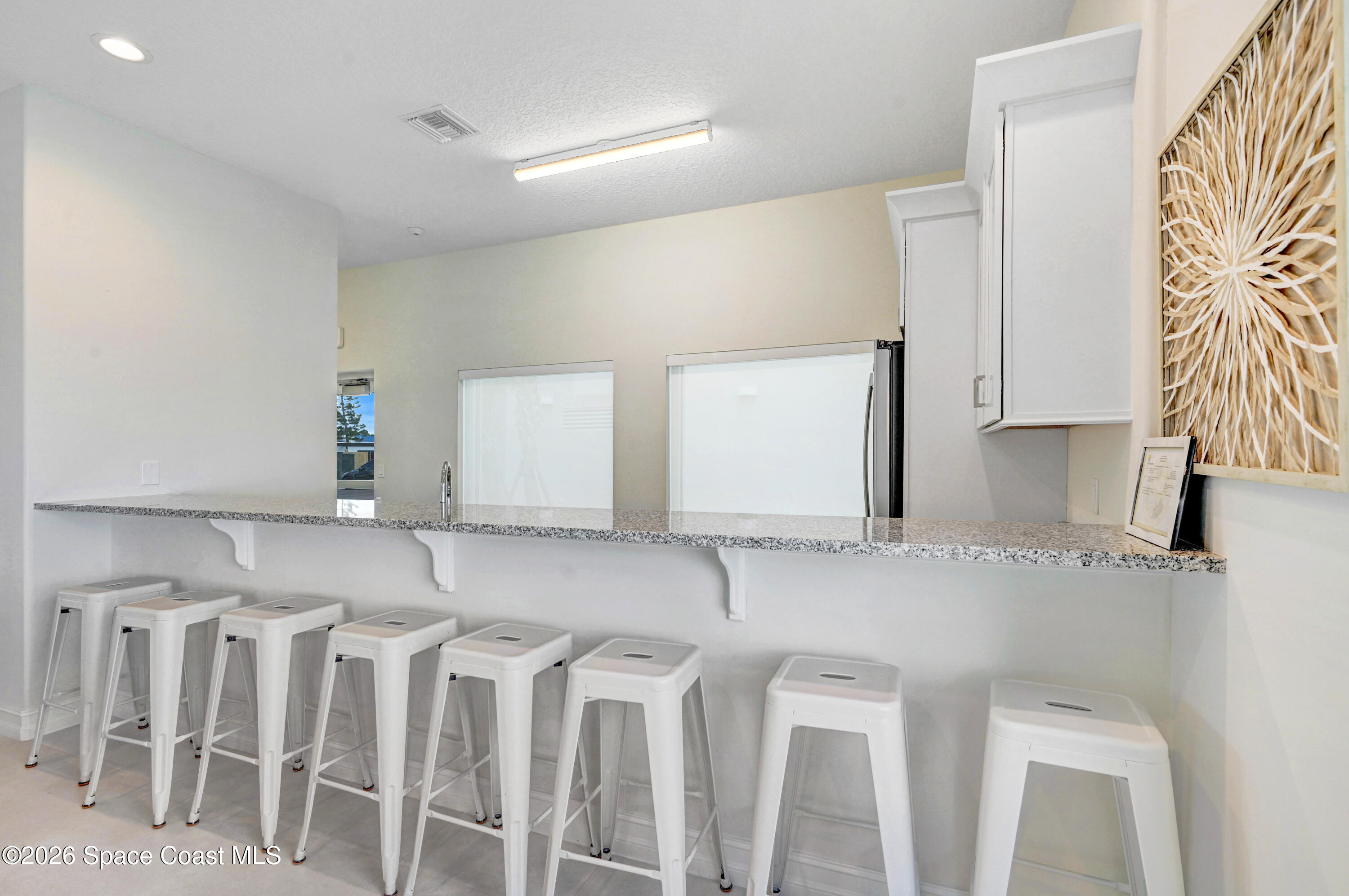 1805 Riverside Drive, Unit 304 Titusville, FL 32780 - Photo 35 of 46 a kitchen with a sink and cabinets