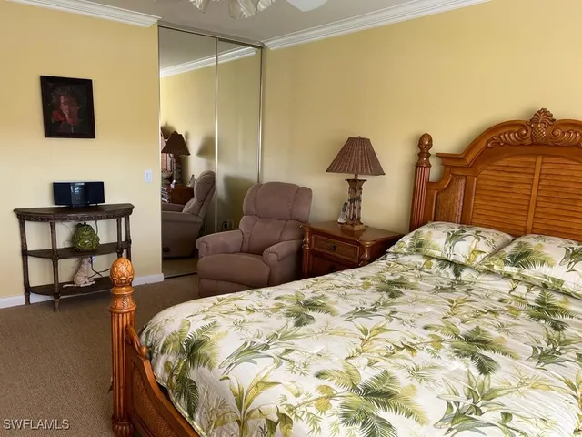 a bedroom with bed and a couch