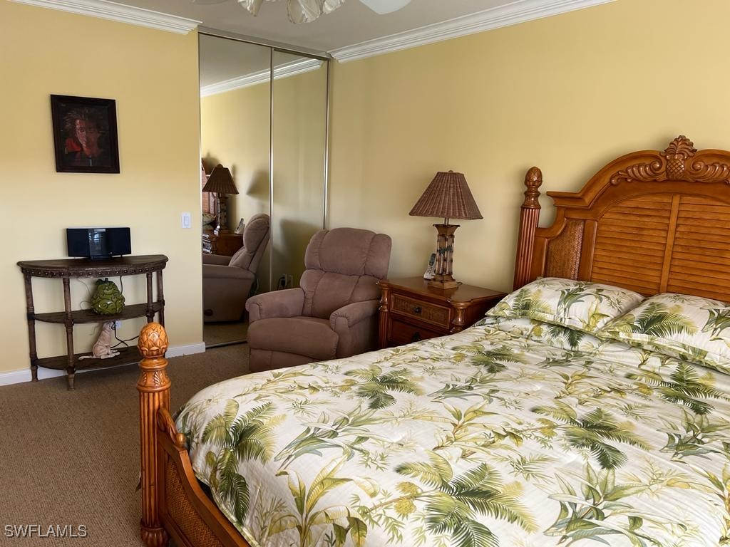 3013 Futuna Lane Naples, FL 34119 - Photo 13 of 21 a bedroom with bed and a couch