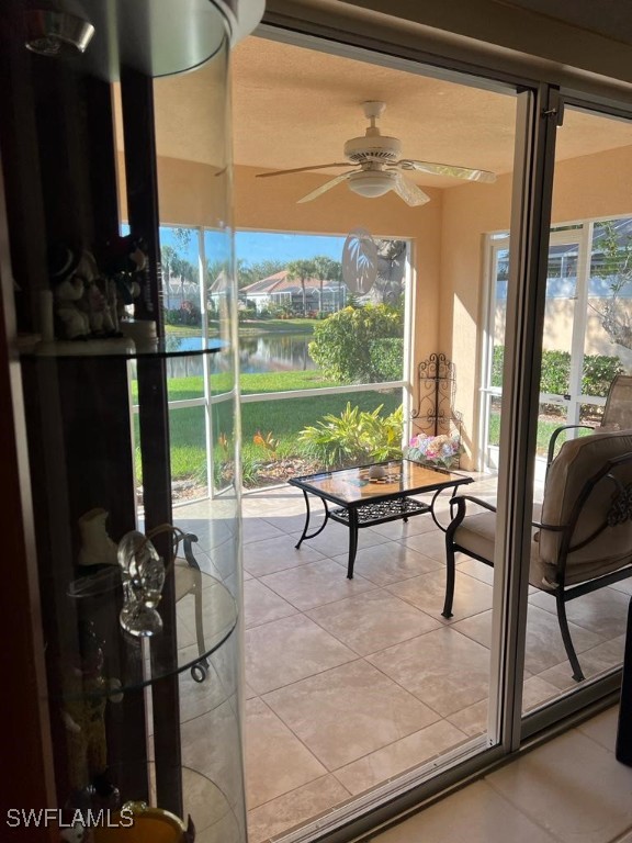 3013 Futuna Lane Naples, FL 34119 - Photo 20 of 21 a living room with furniture and a floor to ceiling window