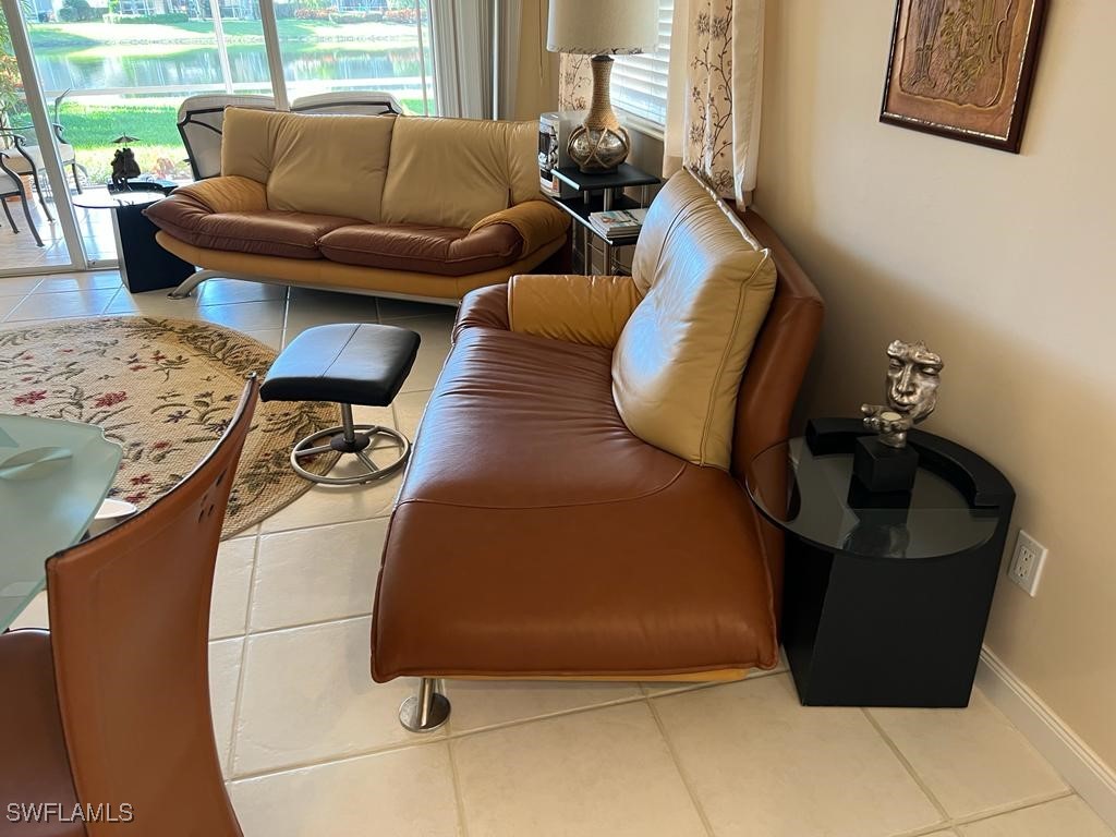 3013 Futuna Lane Naples, FL 34119 - Photo 5 of 21 a living room with furniture and a window