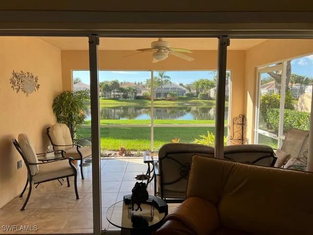a living room with large windows