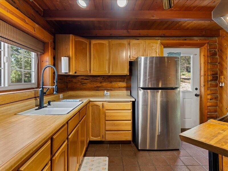 40060 Incline Drive Chiloquin, OR 97624 - Photo 10 of 26 a kitchen with stainless steel appliances granite countertop a refrigerator and a sink