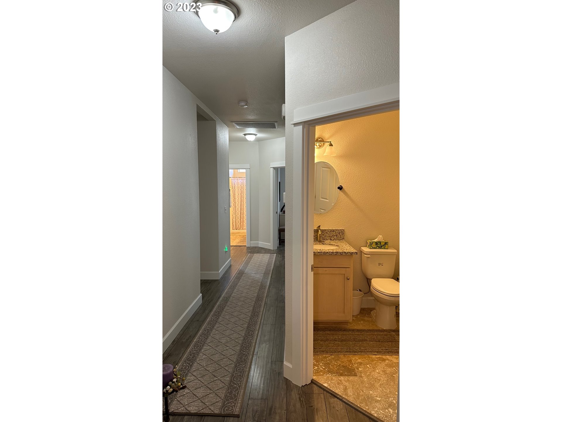746 Divot Loop Sutherlin, OR 97479 - Photo 17 of 32 a bathroom with a glass shower door
