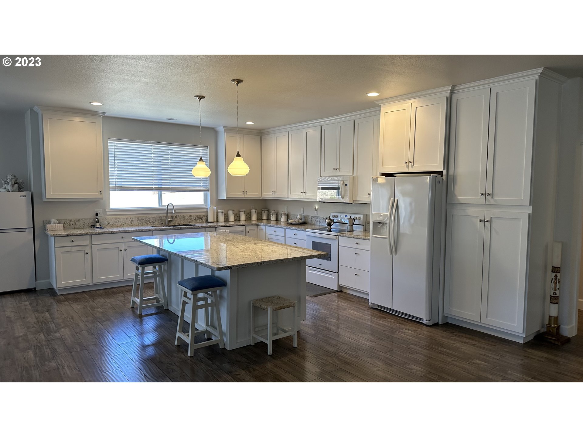 746 Divot Loop Sutherlin, OR 97479 - Photo 19 of 32 a kitchen with a sink cabinets and stainless steel appliances
