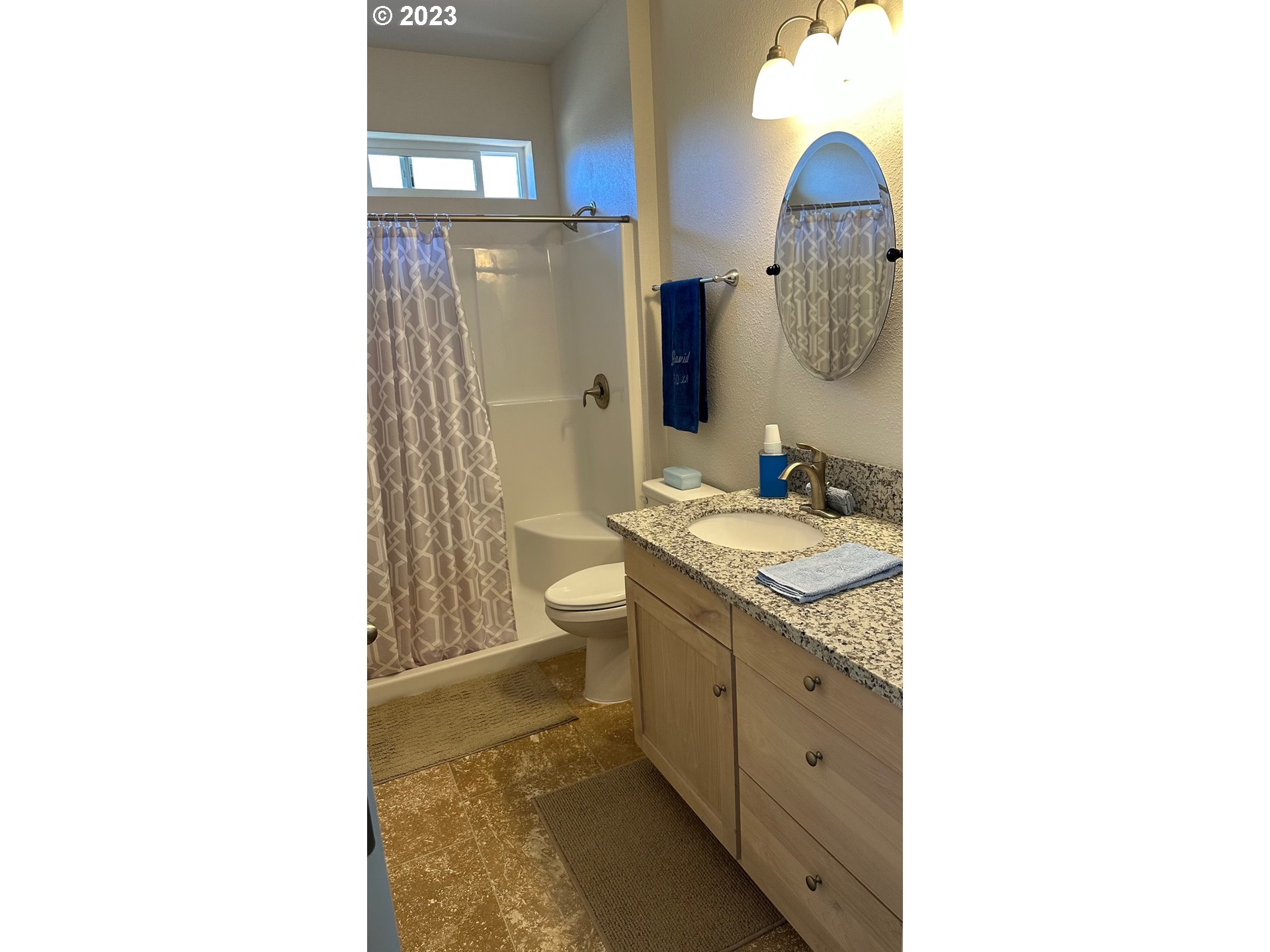 746 Divot Loop Sutherlin, OR 97479 - Photo 20 of 32 a bathroom with a granite countertop sink toilet and shower