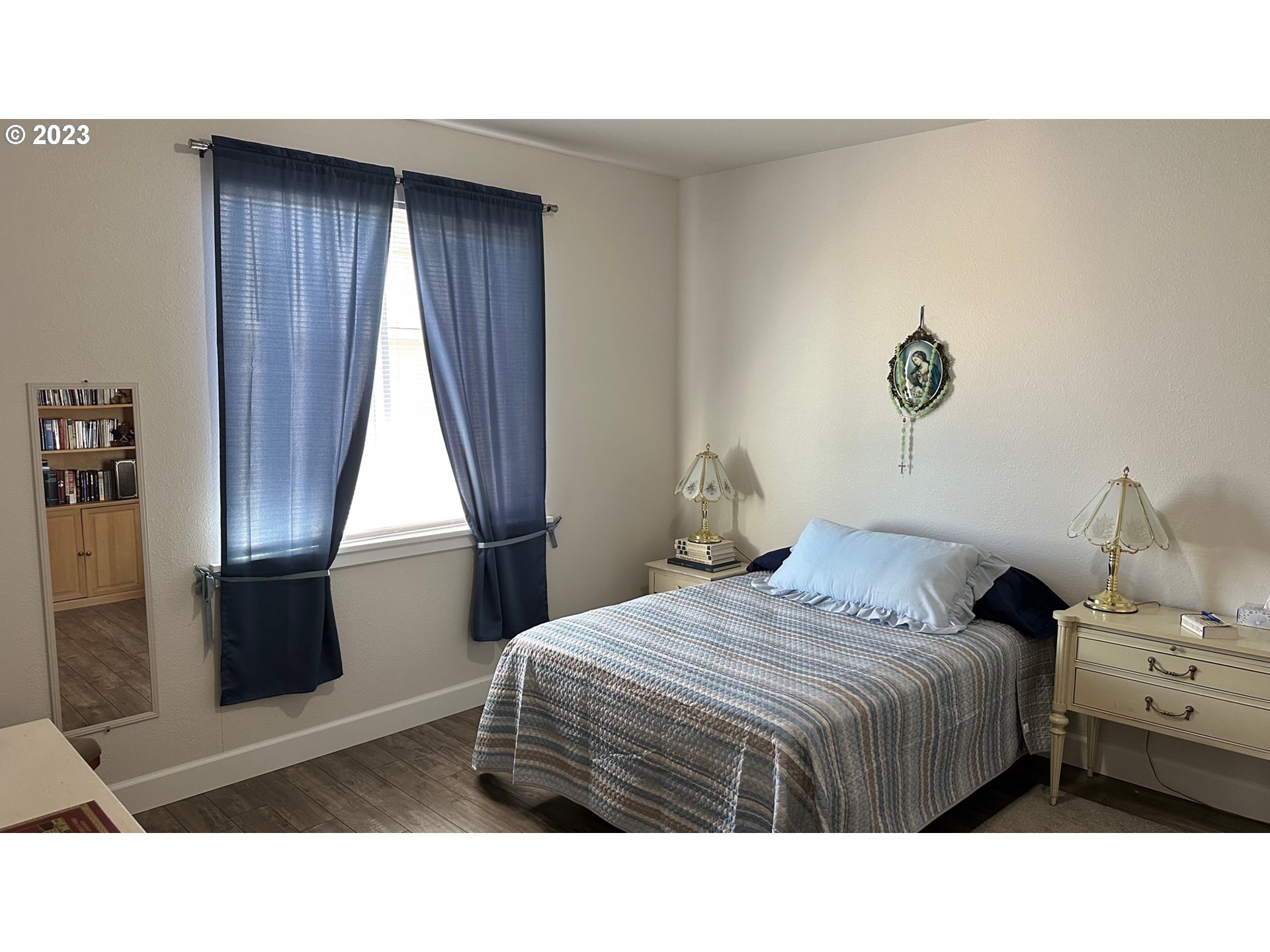 746 Divot Loop Sutherlin, OR 97479 - Photo 21 of 32 a bedroom with a bed and a window