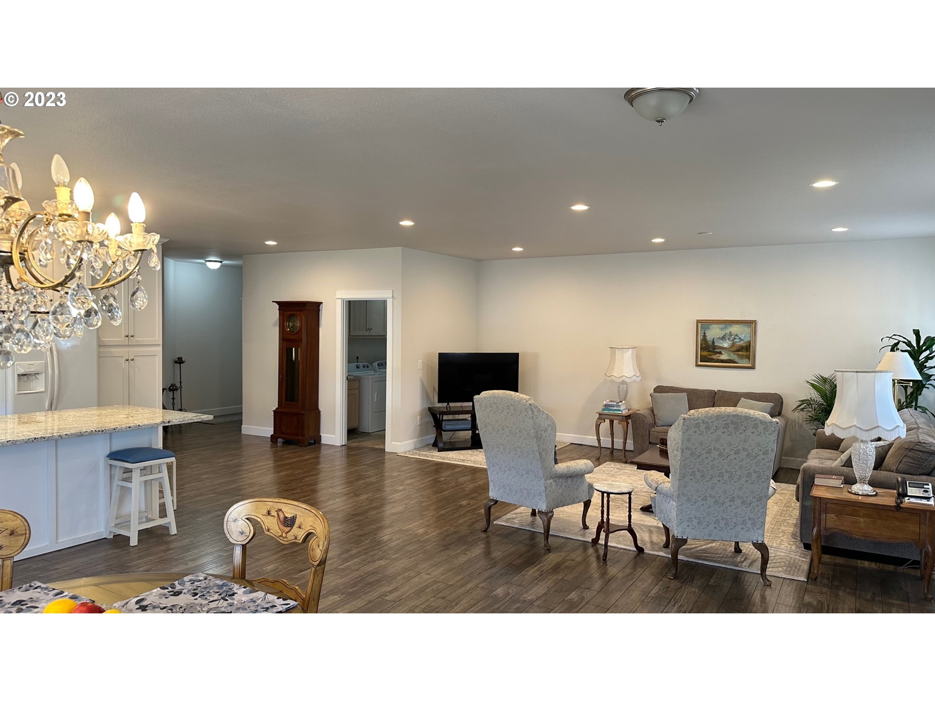 746 Divot Loop Sutherlin, OR 97479 - Photo 22 of 32 a living room with furniture and a chandelier
